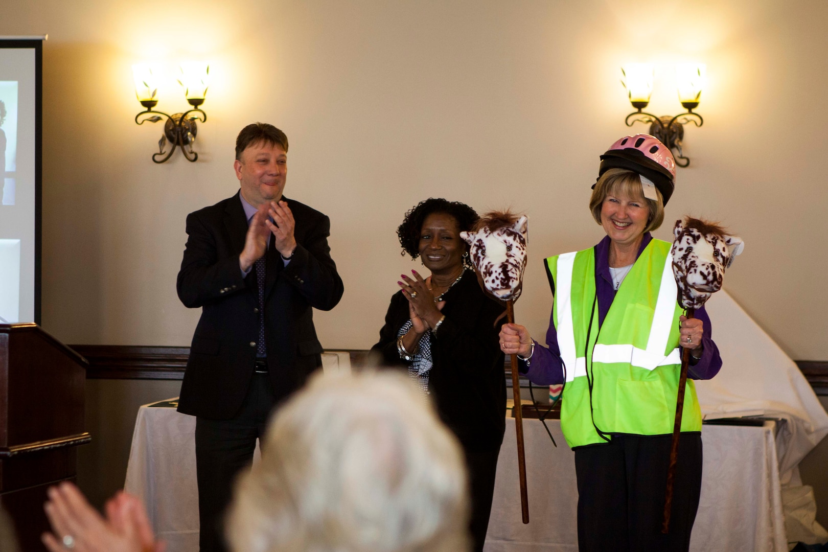 Denise Kurtz receives gifts from her coworkers at her retirement ceremony on March 24.  