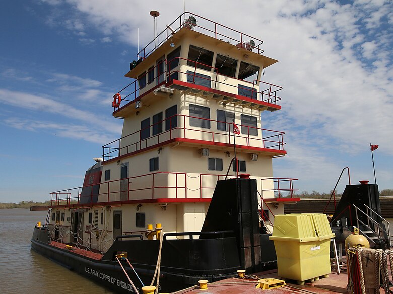 The newly refurbished Mr. Pat floats, tied to a barge on the McClellan-Kerr Arkansas River Navigations System at Lock & Dam 14 near Spiro, Oklahoma.  Mr. Pat is the Tulsa District, U.S. Army Corps of Engineers tow boat that facilitates the movement of a 150 foot barge, housing a crane used for major repairs on the five lock & dam systems of the MKARNS within the Tulsa District. (Photo by Preston Chasteen/Released)