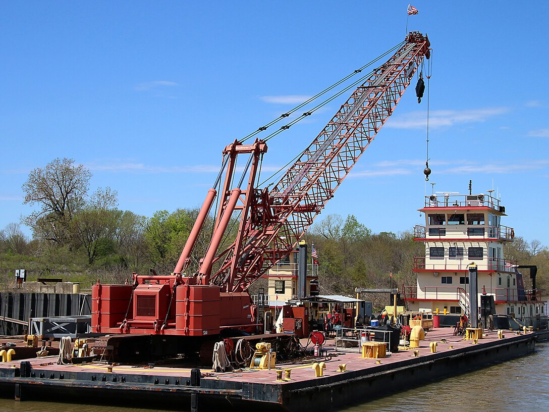 The newly refurbished Mr. Pat floats, tied to a barge on the McClellan-Kerr Arkansas River Navigation System at Lock & Dam 14 near Spiro, Oklahoma.  Mr. Pat is the Tulsa District, U.S. Army Corps of Engineers tow boat that facilitates the movement of a 150 foot barge, housing a crane used for major repairs on the five lock & dam systems of the MKARNS within the Tulsa District. 