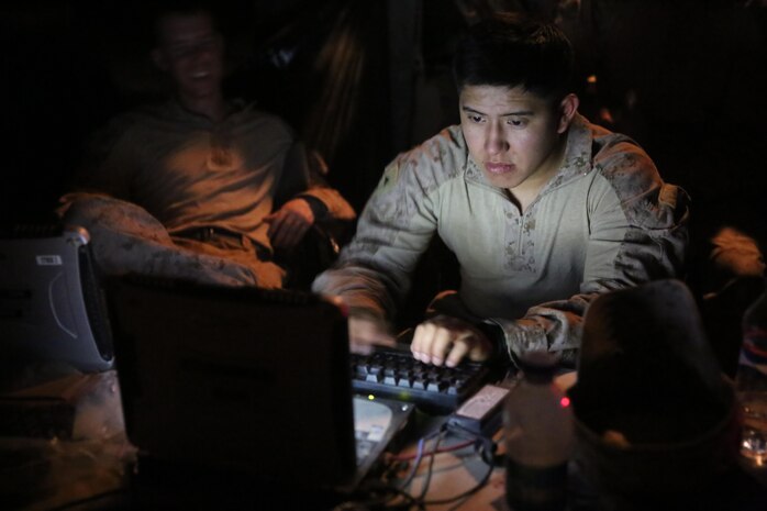 Lance Cpl. Jorge Navejas, intelligence analyst, Headquarters and Service Company, 1st Battalion, 7th Marine Regiment, tracks intelligence reports during a mission in Helmand province, Afghanistan, June 13, 2014. Navejas, a native of San Diego, along with a platoon of infantrymen, provided security at Patrol Base Ouellette, an Afghan National Army controlled-base, during the Afghanistan presidential runoff elections. While International Security Assistance Force stood ready to support as needed, the elections were entirely Afghan led and Afghan conducted.