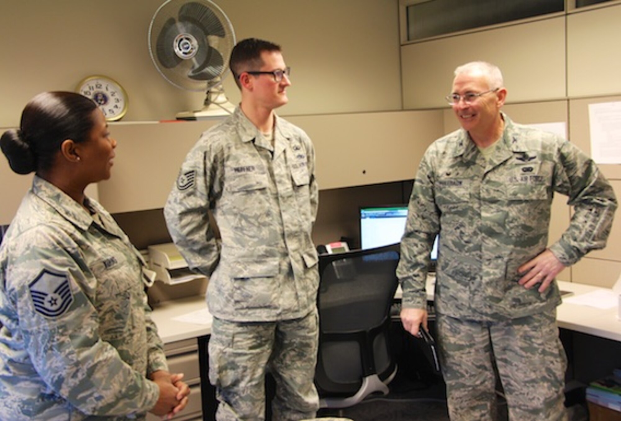 At far right, Col. Jonathan Philebaum, new wing commander at the 932nd Airlift Wing, gives his thoughts on the Chaplain's Office and receives input and valuable feedback information about the mission of their work.  Master Sgt. Jonique Young and Tech Sgt. Daniel Heffner serve as a critical part the religious support team, which includes privileged communication, ethical, moral and morale issues in the wing.  Col. Philebaum spent several hours during both days of the April Unit Training Assembly walking around the wing to hear from various reservists about their work and how they fit as a valued member of Team Scott in Illinois.  (U.S. Air Force photo by Maj. Stan Paregien)