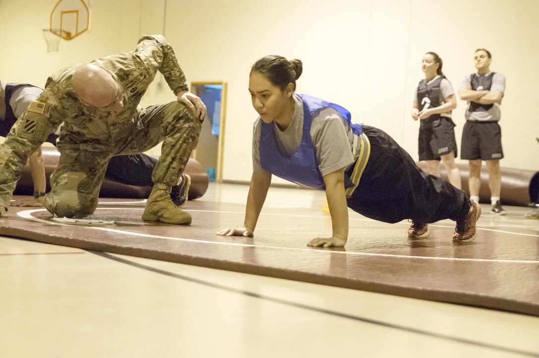 Spc. Ariana Ramirez, from 350th Civil Affairs Command, competes in the Army Physical Fitness Test at the U.S. Army Civil Affairs and Psychological Operations Command Best Warrior Competition at Fort Hunter Liggett, Cali., April 4, 2016. This year’s Best Warrior competition will determine the top noncommissioned officer and junior enlisted Soldier who will represent USACAPOC in the Army Reserve Best Warrior competition later this year. (U.S. Army photo by Spc. Khadijah Lutz-Wilcox, USACAPOC)