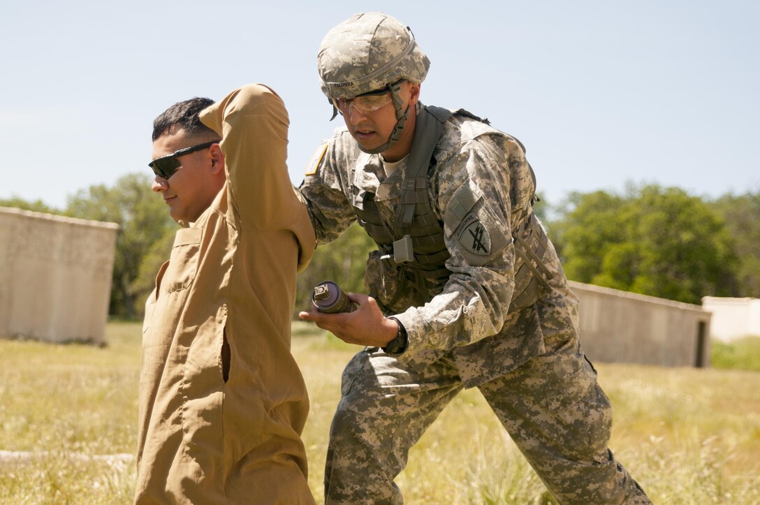 Staff Sgt. Antonio Palomera, from 152nd  Theater Information Operations Group tests his combat skills at the U.S. Army Civil Affairs and Psychological Operations Command Best Warrior Competition at Fort Hunter Liggett, Cali., April 4, 2016. This year’s Best Warrior competition will determine the top noncommissioned officer and junior enlisted Soldier who will represent USACAPOC in the Army Reserve Best Warrior competition later this year. (U.S. Army photo by Spc. Khadijah Lutz-Wilcox, USACAPOC)