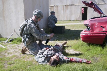 Spc. Ian Duprey, from 437th Civil Affairs Battalion tests his combat skills at the U.S. Army Civil Affairs and Psychological Operations Command Best Warrior Competition at Fort Hunter Liggett, Cali., April 4, 2016. This year’s Best Warrior competition will determine the top noncommissioned officer and junior enlisted Soldier who will represent USACAPOC in the Army Reserve Best Warrior competition later this year. (U.S. Army photo by Spc. Khadijah Lutz-Wilcox, USACAPOC)