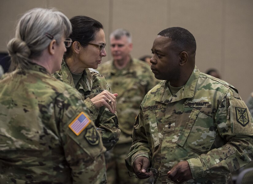 Maj. Gen. Phillip Churn (right), commanding general of the 200th Military Police Command, speaks with his deputy commanding generals, Brig. Gen. Marion Garcia and Brig. Gen. Kelly Wakefield, during a four-day workshop and Yearly Training Brief conference held by the 200th MP Cmd. in Columbus, Ohio, on April 2. During the event, battalion and brigade leaders worked to improve their readiness and briefed the commanding general and his command leadership on their units' status. (U.S. Army photo by Master Sgt. Michel Sauret)