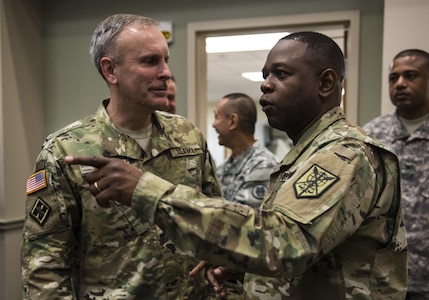 Maj. Gen. Phillip Churn (right), commanding general of the 200th Military Police Command, speaks with Brig. Gen. Phillip Jolly, with the Army Reserve Engagement Cell (AREC), U.S. Army Europe, Germany, during a four-day workshop and Yearly Training Brief conference held by the 200th MP Cmd. in Columbus, Ohio, beginning March 31. During the event, the units' leaders worked to improve their readiness and briefed the commanding general and his command leadership on their units' status. AREC members from various Army Service Component Commands attended this YTB in order to grow partnerships between the 200th MP Cmd. and Army component commands across the globe. (U.S. Army photo by Master Sgt. Michel Sauret)