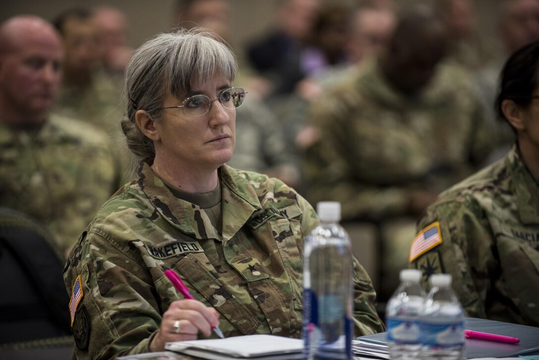 Brig. Gen. Kelly Wakefield, deputy commanding general (support) for the 200th Military Police Command, takes notes while listening to a presenter at a Yearly Training Brief conference held in Columbus, Ohio, April 2. During the event, battalion and brigade leaders worked to improve their readiness and briefed the commanding general and his command leadership on their units' status. (U.S. Army photo by Master Sgt. Michel Sauret)
