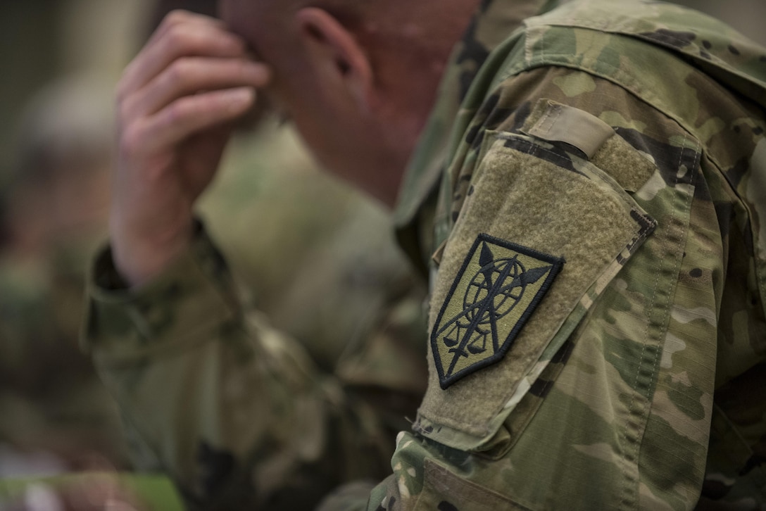 A member of the 200th Military Police Command headquarters looks over some notes during a Yearly Training Brief conference held in Columbus, Ohio, April 2. During the event, battalion and brigade leaders worked to improve their readiness and briefed the commanding general and his command leadership on their units' status. (U.S. Army photo by Master Sgt. Michel Sauret)