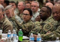 Maj. Gen. Phillip Churn (right), commanding general of the 200th Military Police Command, and Brig. Gen. Marion Garcia, deputy commanding general (operations), discuss information posted on a screen during a four-day workshop and Yearly Training Brief conference held by the 200th MP Cmd. in Columbus, Ohio, on April 2. During the event, battalion and brigade leaders worked to improve their readiness and briefed the commanding general and his command leadership on their units' status. (U.S. Army photo by Master Sgt. Michel Sauret)