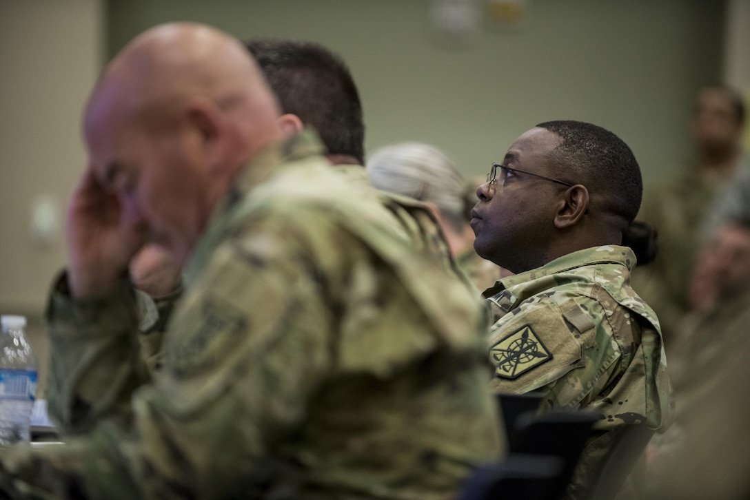 Maj. Gen. Phillip Churn, commanding general of the 200th Military Police Command, listens to a battalion briefing on the final day of a Yearly Training Brief conference held in Columbus, Ohio, April 3. During the event, battalion and brigade leaders worked to improve their readiness and briefed the commanding general and his command leadership on their units' status. (U.S. Army photo by Master Sgt. Michel Sauret)