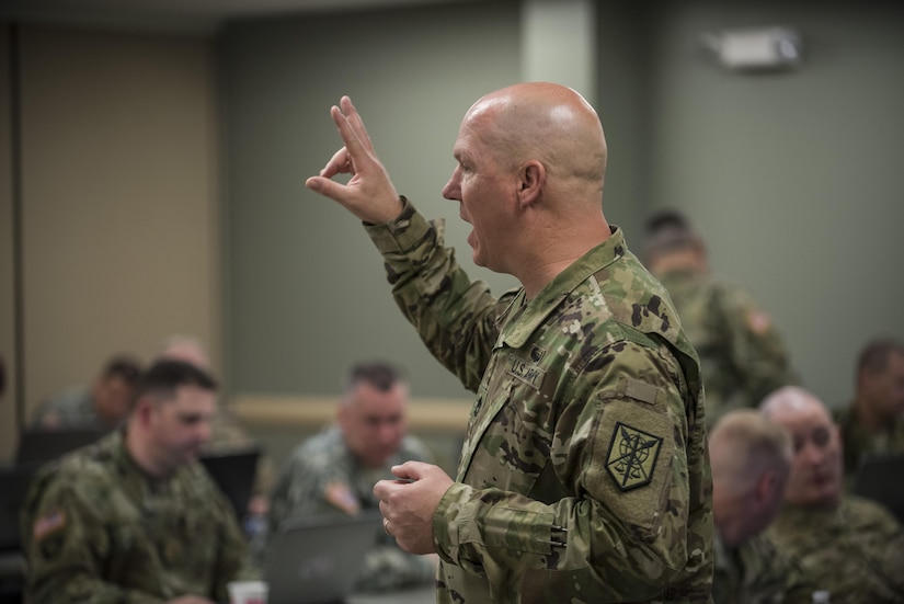 Sgt. 1st Class Donald Snow, the schools and training noncommissioned officer for the 200th Military Police Command, runs a workshop with the command's subordinate brigades and battalions during a four-day workshop and Yearly Training Brief conference held in Columbus, Ohio, on March 31. During the event, the units' leaders worked to improve their readiness and briefed the commanding general and his command leadership on their units' status. (U.S. Army photo by Master Sgt. Michel Sauret)