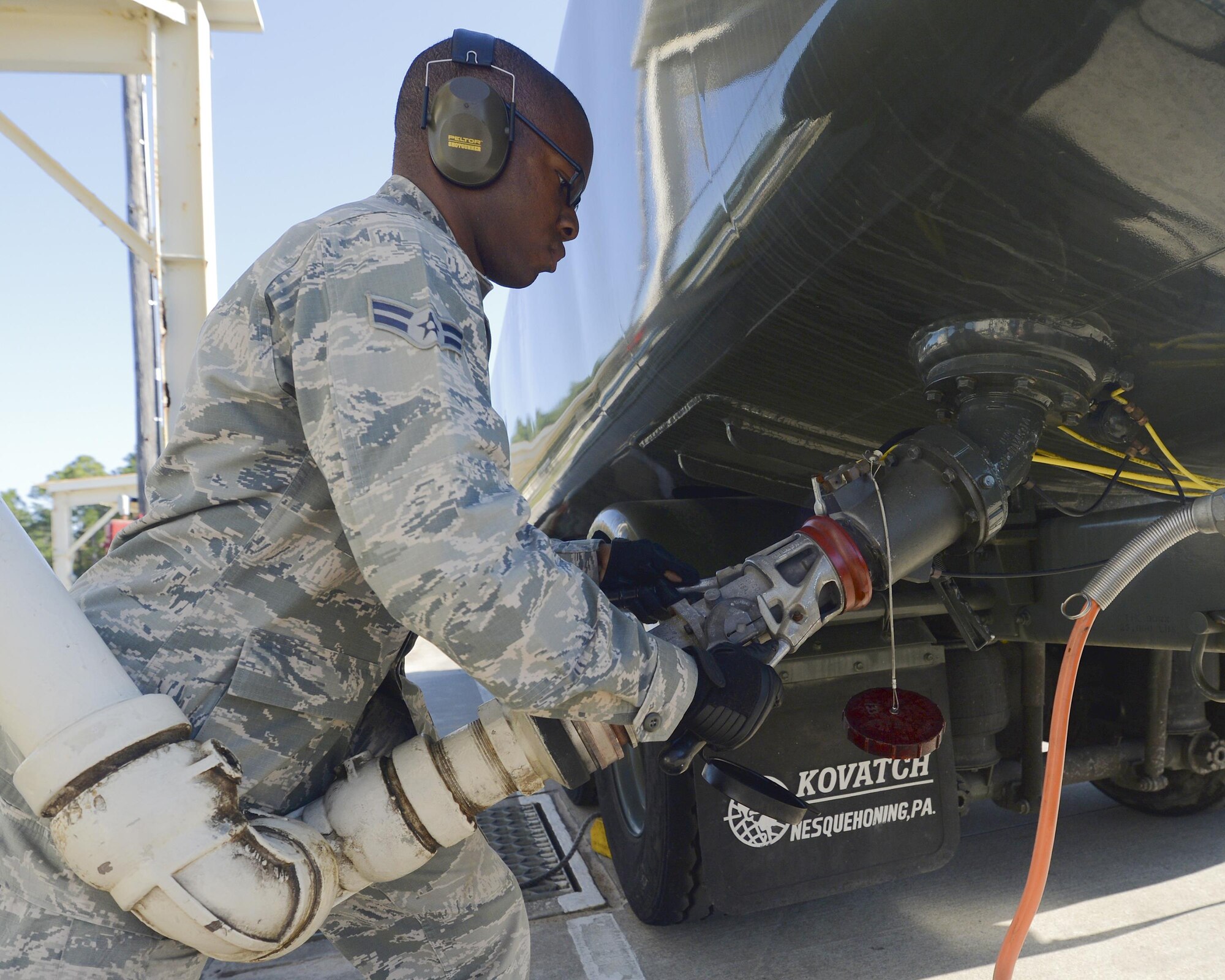 Airman 1st Class George Phillips, 325th Logistics Readiness Squadron fuels distribution technician, attaches a refueling hose to a fuel truck at Tyndall Air Force Base, April 5. The Fuels Management Flight of the 325th LRS supplies fuel to the entire base and supports the flying mission by fueling every aircraft that comes on station. (U.S. Air Force photo by Airman 1st Class Cody R. Miller/Released)