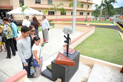 Fort Buchanan Survivor Outreach Service (SOS) hosted a Gold Star Recognition Ceremony in front of U.S. Army Garrison Headquarters, Fort Buchanan on April, 5th. Ms. Sonia Rodriguez, her son Jean Carlos Rodriguez and her daughter Janyvette Rodriguez, reflect in front of the "Fallen Heroes" Memorial.