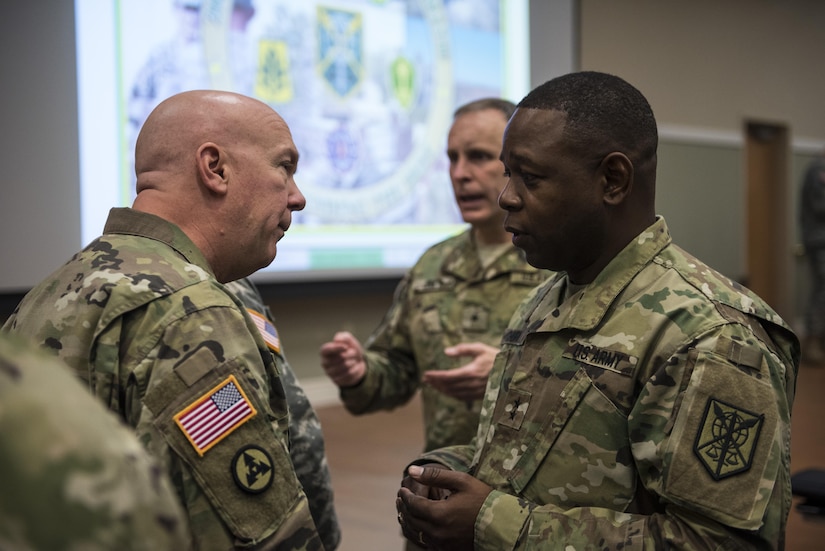 Maj. Gen. Phillip Churn (right), commanding general of the 200th Military Police Command, speaks with Brig. Gen. Peter Bosse, with the Army Reserve Engagement Cell (AREC), U.S. Army North, during a four-day workshop and Yearly Training Brief conference held by the 200th MP Cmd. in Columbus, Ohio, on April 2. During the event, the units' leaders worked to improve their readiness and briefed the commanding general and his command leadership on their units' status. AREC members from various Army Service Component Commands attended this YTB in order to grow partnerships between the 200th MP Cmd. and Army component commands across the globe. (U.S. Army photo by Master Sgt. Michel Sauret)