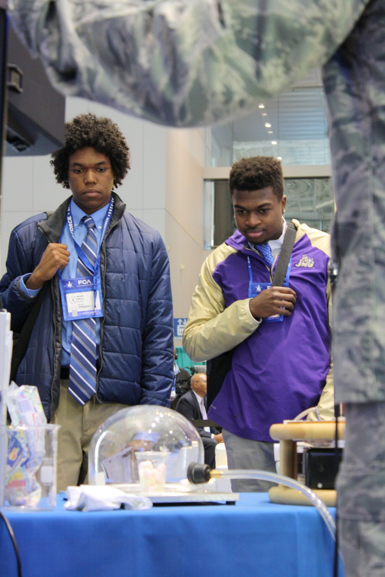 Students watch as Tech. Sgt. Michael McLane, of the Air Force Technical Applications Center at Patrick Air Force Base, Fla., narrates demonstrations at the 42nd annual convention of the National Society of Black Engineers on March 25, 2016, at the Boston Convention and Exhibition Center. The Air Force had representatives from across the service at the convention to attract up and coming engineering talent and current professionals to careers in the Air Force. (Courtesy photo)