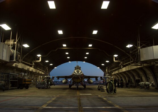 Airmen with the 35th Aircraft Maintenance Squadron arm an F-16 Fighting Falcon during a two-day surge exercise at Misawa Air Base, Japan, April 5, 2016. Along with standard maintenance to aircraft before and after flight, weapons load crew teams armed the aircraft to simulate a combat environment. During deployed operations, loading is essential for the F-16’s air-to-air combat and air-to-surface attacks. (U.S. Air Force photo/Airman 1st Class Jordyn Fetter)