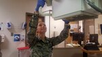 Senior Airman Meagan Tavares, 59th Medical Wing radiology technician, adjusts her X-ray machine at Wilford Hall Ambulatory Surgical Center before seeing a patient. Tavares wants to become a physician's assistant after the Air Force.