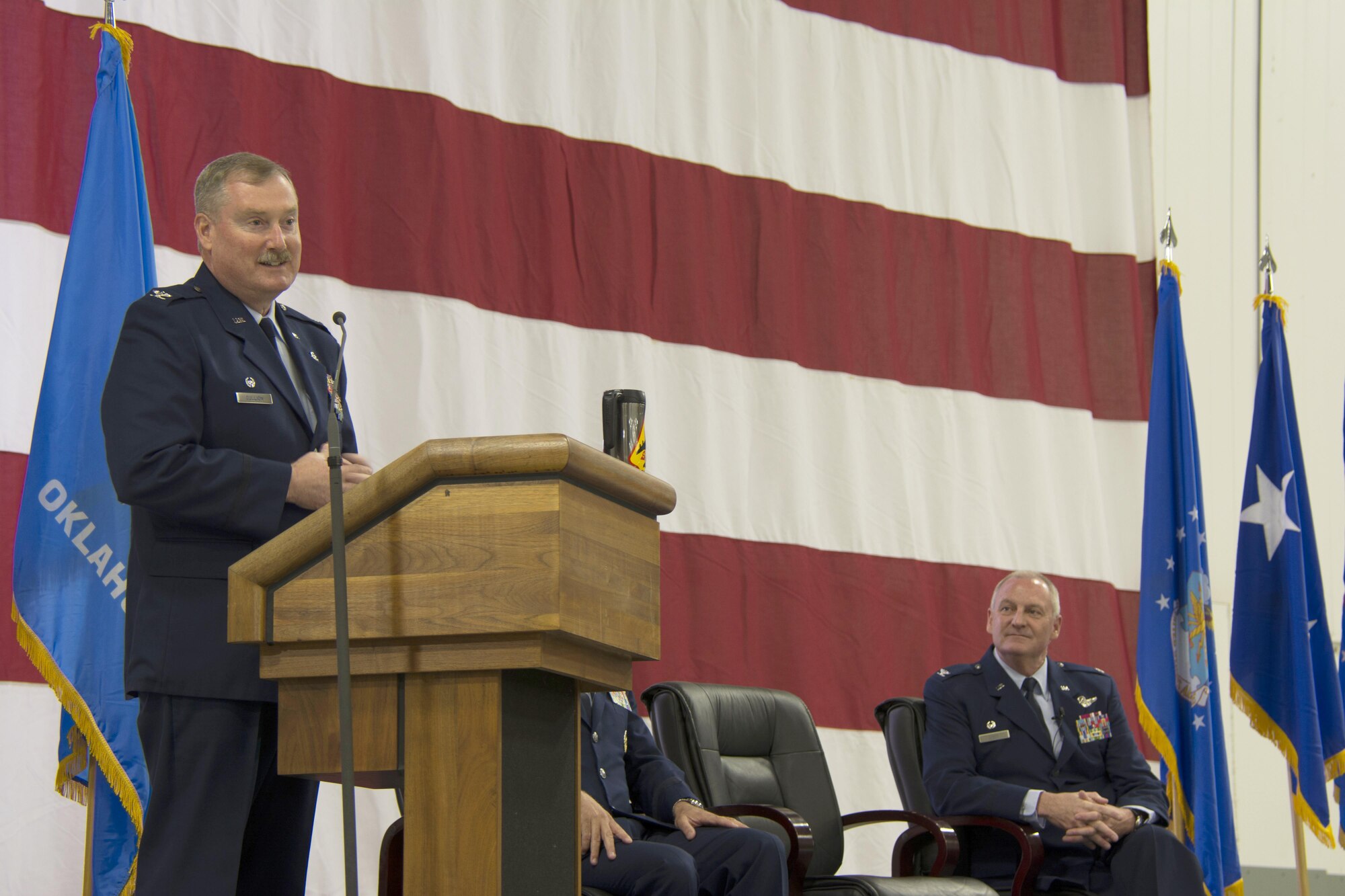 Col. Douglas E. Gullion, 507th Air Refueling Wing commander, addresses the wing as former commander, Col. Brian S. Davis, looks on at the wing change of command ceremony April 2, 2016, at Tinker Air Force Base. Gullion took command of the wing after serving as the 507th Operations Group commander, and now will lead the 1,110 Airmen in the 507th ARW, the largest Reserve flying unit in the state of Oklahoma. (U.S. Air Force photo/Maj. Jon Quinlan)