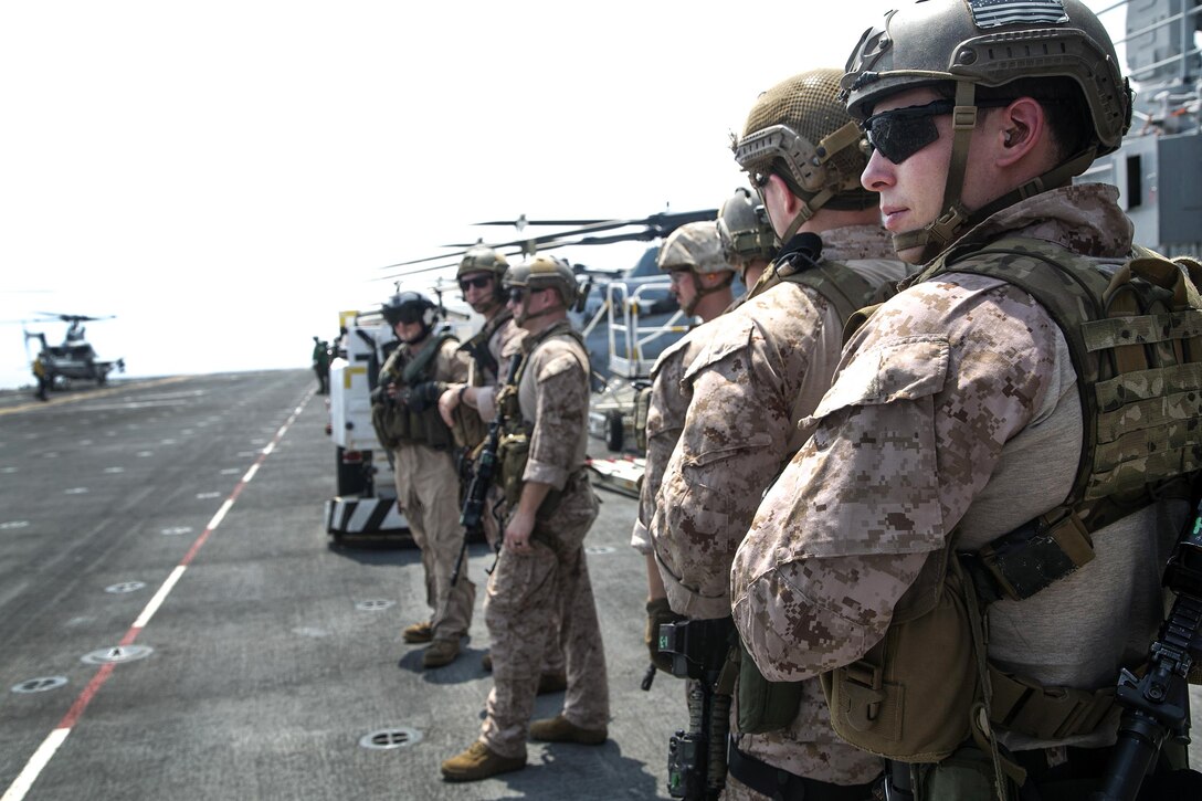 Marines await helicopters for rappel training aboard the USS Boxer in the Pacific Ocean, April, 1, 2016. The Marines are assigned to the 13th Marine Expeditionary Unit. Marines and sailors assigned to the Boxer Amphibious Ready Group, 13th Marine Expeditionary Unit are transiting the Pacific Ocean toward the U.S. 5th fleet area of operations. Marine Corps photo by Sgt. Briauna Birl