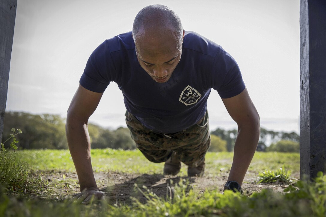 Marine Corps Staff Sgt. Kevin Dunbar does pushups during the Commanding General's Fitness Cup Challenge at Marine Corps Recruit Depot Parris Island, S.C., March 25, 2016. Dunbar is a senior drill instructor assigned to Mike Company, 3rd Recruit Training Battalion, Recruit Training Regiment. Marine Corps photo by Lance Cpl. Richard Currier

