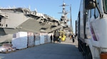 Navy and Subsistence prime vendor personnel load the USS Stennis with food March 16 before the aircraft carrier departs Naval Base Busan, Republic of Korea, for Operation Foal Eagle. The annual training exercise promotes the partnership between the United States and South Korea.