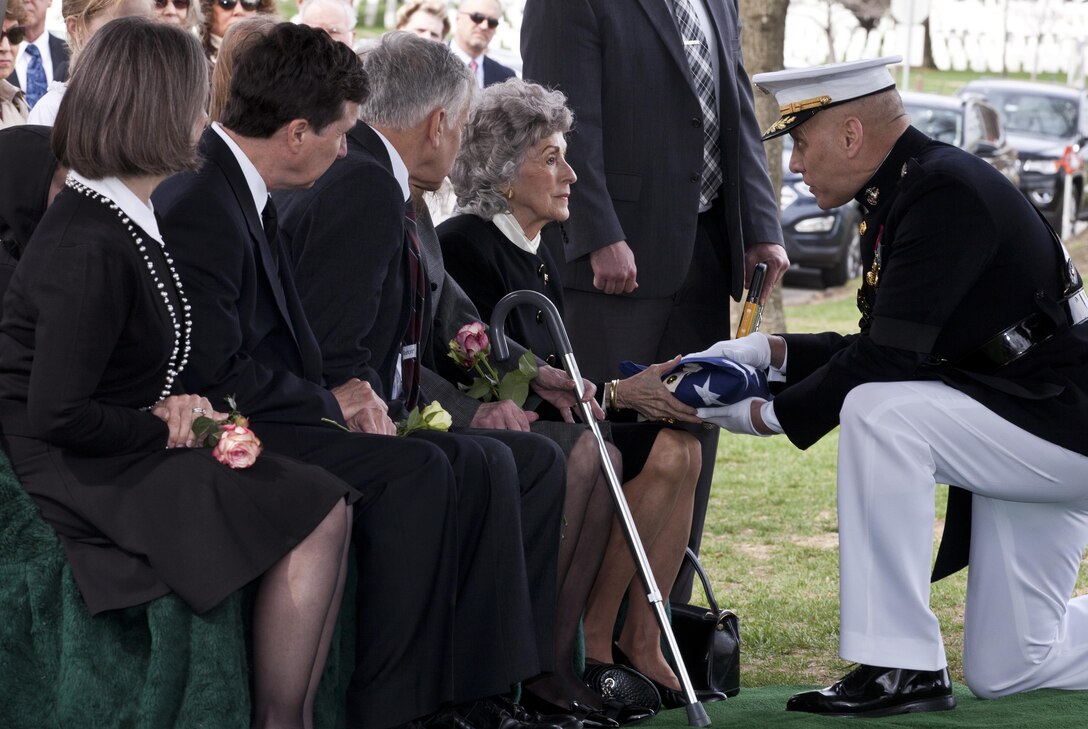 U.S. Marine Corps Gen. John M. Paxton, assistant commandant of the Marine Corps, presents flag to Jane Anderson, wife of retired Gen. Earl E. Anderson, former assistant commandant of the Marine Corps, during a funeral for her husband at the Arlington National Cemetery, Arlington, Va., March 31, 2016. Anderson was the first active duty Marine Naval Aviator to be promoted to four-star rank, and he became the assistant commandant of the Marine Corps on April 1, 1972. (U.S. Marine Corps photo by Lance Cpl. Alex A. Quiles /Released)

