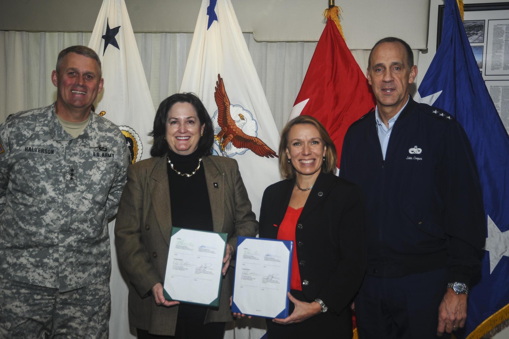 From left to right, Lt. Gen. David Halverson, the Army assistant chief of staff for installation management; Katherine Hammock, the assistant secretary of the Army for installations, energy and environment; Miranda Ballentine, the assistant secretary of the Air Force for installations, environment and energy; and Lt. Gen. John Cooper, the Air Force deputy chief of staff for logistics, engineering and force protection, pose for a photo after signing a memorandum of agreement that formalizes the partnership between the service energy offices at the Pentagon, Washington, D.C., April 6, 2016. (U.S. Air Force photo/Antoinette Smith)