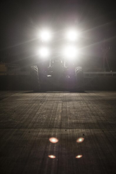 A U.S. Air Force Airman from the 18th Civil Engineer Squadron maneuvers a grader plow during an airfield damage repair contingency exercise at the Silver Flag training site April 5, 2016, at Kadena Air Base, Japan. Airmen with the18th CES conducted training to enhance their readiness to persevere with continuous airfield repair operations in a hostile environment. (U.S. Air Force photo by Senior Airman Peter Reft/Released)