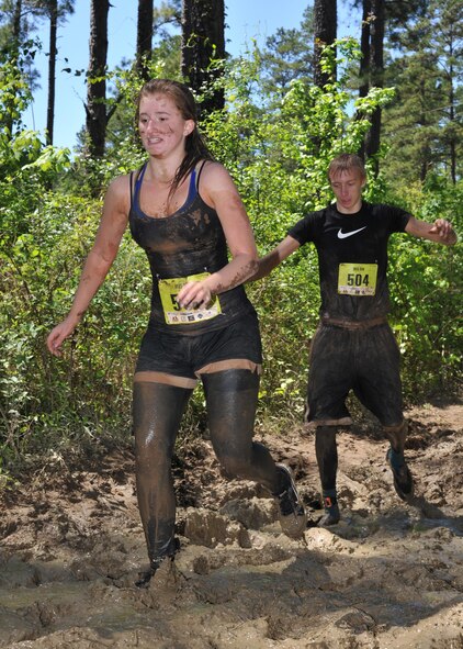 Participants slog through a long stretch of deep mud during the 2016 Defenders of Liberty Mud run at Barksdale Air Force Base, La., April 2. More than 500 people ran the 4-mile course, all of whom got incredibly muddy while conquering 20 obstacles along the way. (U.S. Air Force photo/Senior Airman Joseph Raatz)
