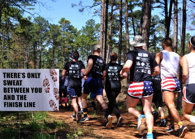 Participants cross the starting line to begin the 2016 Defenders of Liberty Mud Run at Barksdale Air Force Base, La., April 2. More than 500 people ran the 4-mile course, braving 20 obstacles along the way. (U.S. Air Force photo/Senior Airman Joseph Raatz)
