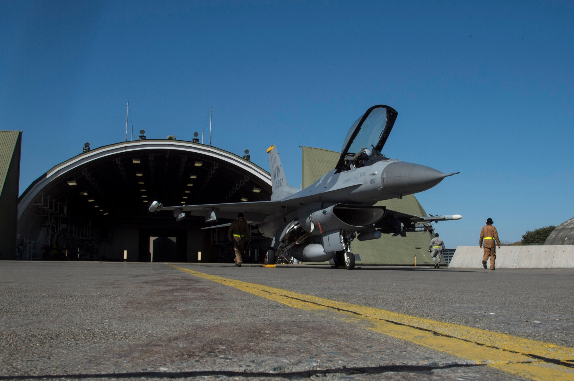 A U.S. Air Force F-16 Fighting Falcon sits on the flightline after a sortie during a two-day surge exercise at Misawa Air Base, Japan, April 5, 2016. During surge operations, the 35th Fighter Wing demonstrated their ability to generate aircraft in a combat-like scenario with an increase in sorties from between 10 to 20 each day, to approximately 70. (U.S. Air Force photo by Airman 1st Class Jordyn Fetter/Released)