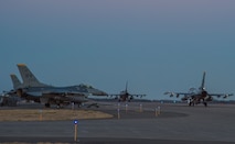 U.S. Air Force F-16 Fighting Falcons taxi down the flightline during a surge operation at Misawa Air Base, Japan, April 5, 2016. The exercise was conducted to validate the 35th Fighter Wing’s ability to generate aircraft in a simulated combat scenario, with more than 70 sorties per fighter squadron being flown each day. (U.S. Air Force photo by Airman 1st Class Jordyn Fetter/Released)