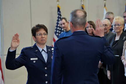 Maj. Gen. Daryl Bohac administers the oath of office to newly promoted Brig. Gen. Wendy Johnson during a ceremony at the Nebraska National Guard’s Joint Force Headquarters in Lincoln, Nebraska on April 2, 2016.