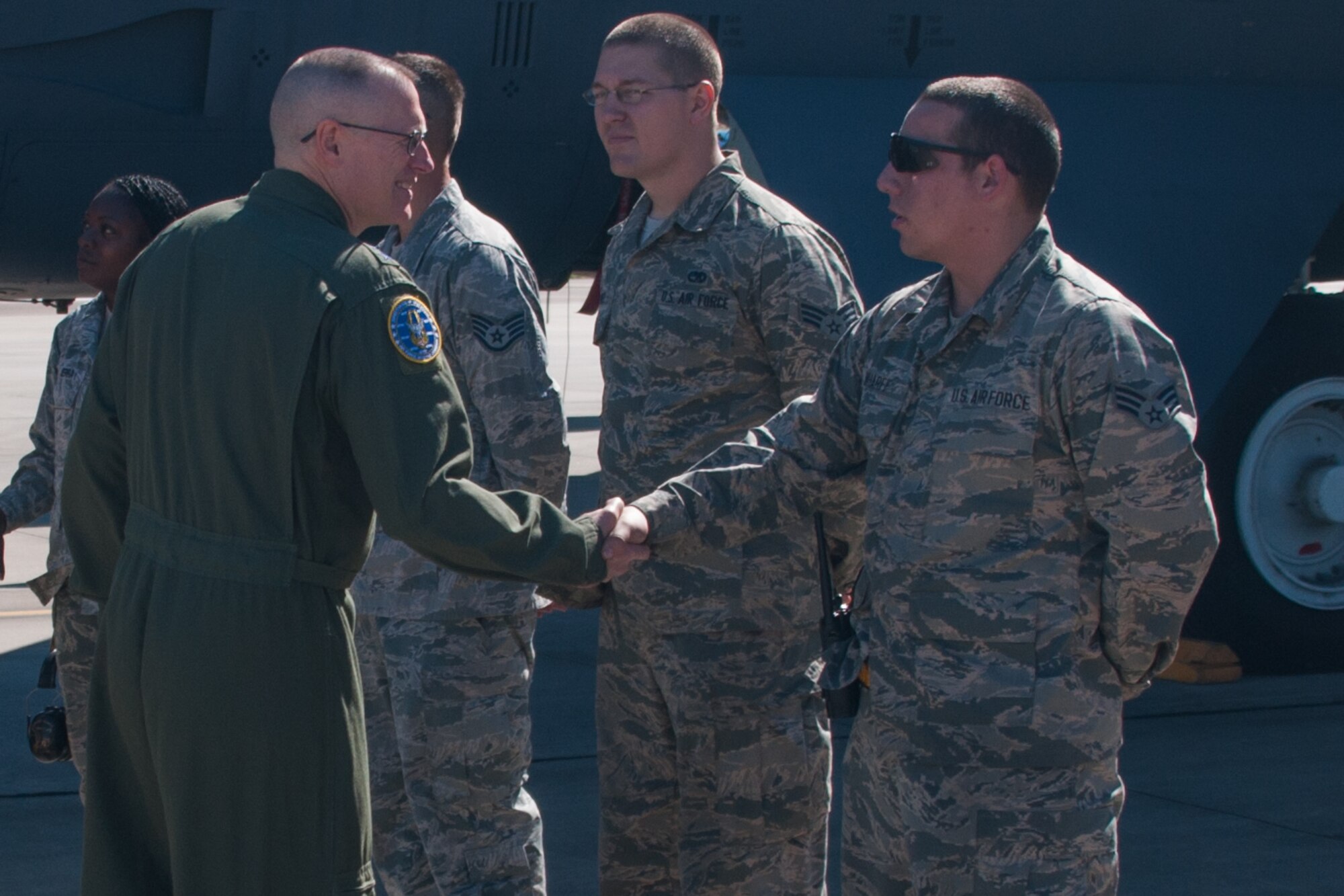 U.S. Air Force Maj. Gen. Ken Lewis, the AFRC director of Air, Space and Information Operations, shakes hands with Senior Airman Justin Wharff, assigned to the 2nd Aircraft Maintenance Squadron (AMXS), on Barksdale Air Force Base, La., April 4, 2016. Wharff is part of the Total Force Integration (TFI) between the Active Duty AMXS and the Reserve 307th AMXS. Lewis received a tour of a B-52 Stratofortress from the TFI crew during his visit to Barksdale. (U.S. Air Force photo by Master Sgt. Dachelle Melville)
