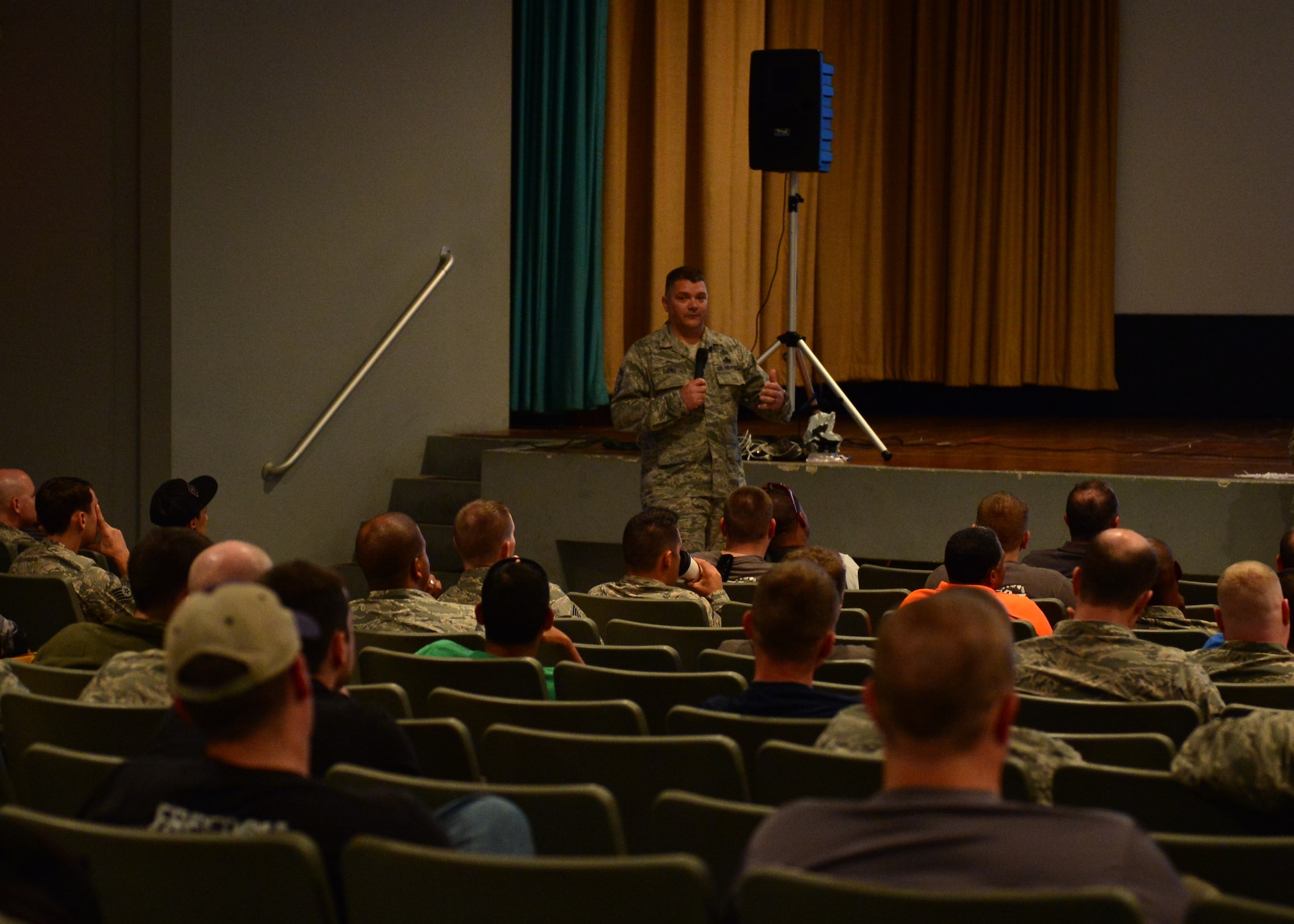Senior Master Sgt. Travis Davis, superintendent of Occupational Safety Division for Headquarters Pacific Air Forces, briefs military motorcycles riders during Motorcycle Safety Day on Joint Base Pearl Harbor-Hickam, April 1, 2016. Approximately 175 motorcycle riders from JBPHH met up at the Hickam Memorial  Theater to talk about motorcycle safety as well as share personal stories and experiences pertaining to riding. The motorcycle safety event fulfilled an Air Force annual requirement for motorcycle riders.(U.S. Air Force photo by Tech. Sgt. Aaron Oelrich/released) 


