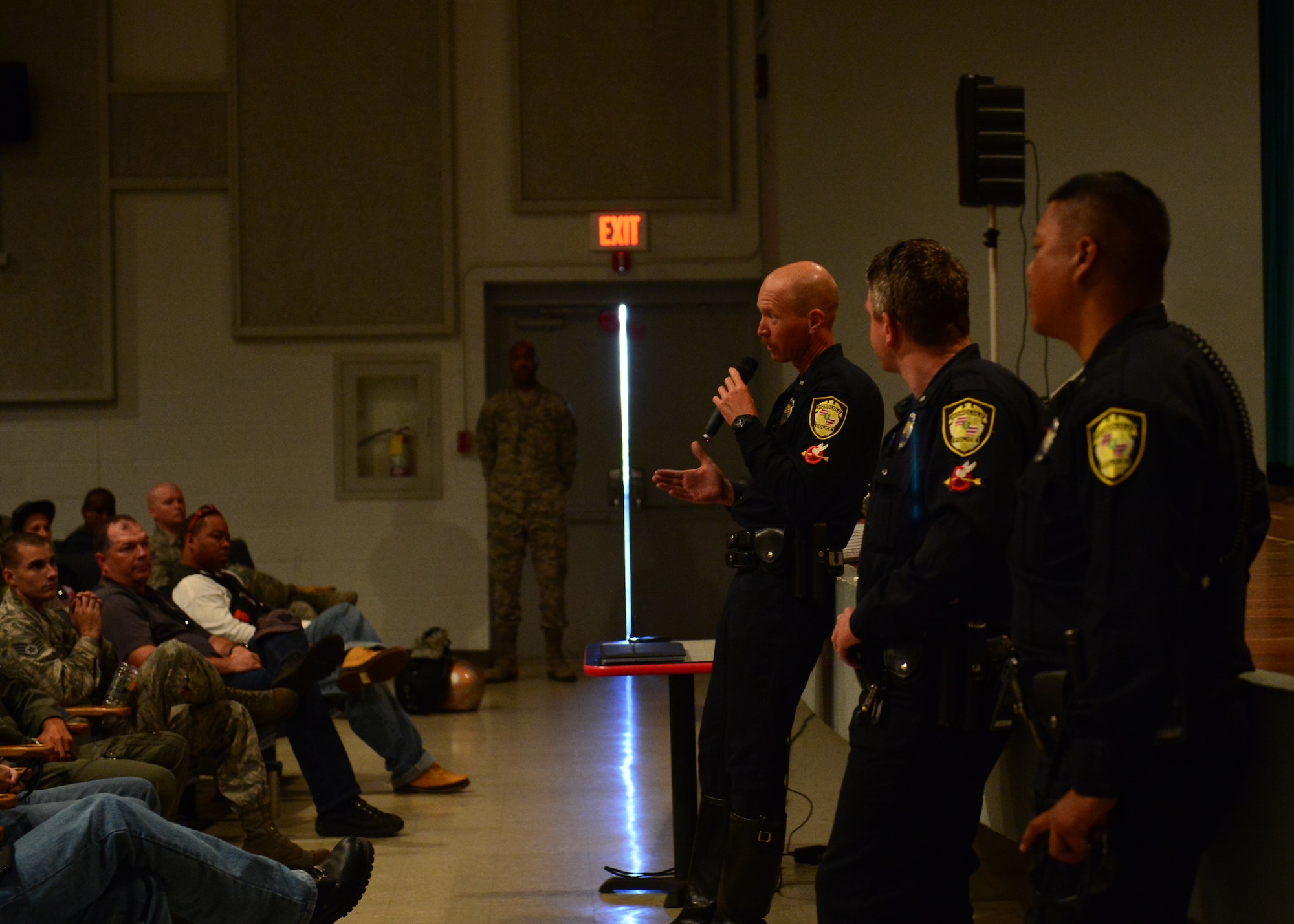 Three motorcycle police officers from the Honolulu Police Department brief the importance of situational awareness when riding motorcycles during Motorcycle Safety Day on Joint Base Pearl Harbor-Hickam, April 1, 2016. Approximately 175 motorcycle riders from JBPHH met up at the Hickam Memorial  Theater to talk about motorcycle safety as well as share personal stories and experiences pertaining to riding. The motorcycle safety event fulfilled an Air Force annual requirement for motorcycle riders(U.S. Air Force photo by Tech. Sgt. Aaron Oelrich/released) 