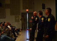 Three motorcycle police officers from the Honolulu Police Department brief the importance of situational awareness when riding motorcycles during Motorcycle Safety Day on Joint Base Pearl Harbor-Hickam, April 1, 2016. Approximately 175 motorcycle riders from JBPHH met up at the Hickam Memorial  Theater to talk about motorcycle safety as well as share personal stories and experiences pertaining to riding. The motorcycle safety event fulfilled an Air Force annual requirement for motorcycle riders(U.S. Air Force photo by Tech. Sgt. Aaron Oelrich/released) 