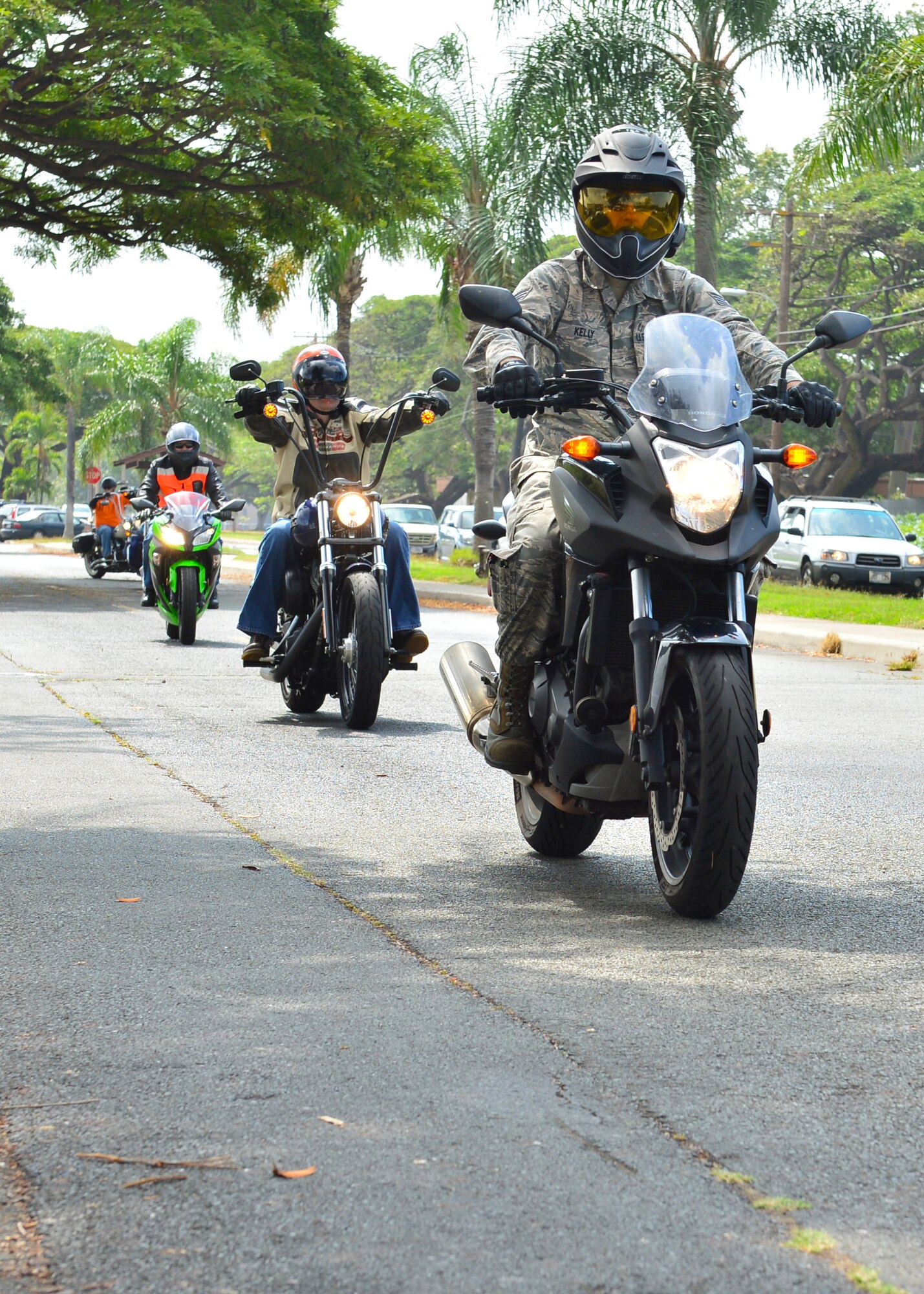 Military members from Headquarters Pacific Air Forces and 15th Wing ride across the installation after receiving a motorcycle safety briefing during Motorcycle Safety Day on Joint Base Pearl Harbor-Hickam, April 1, 2016. Approximately 175 motorcycle riders from JBPHH met up at the Hickam Memorial  Theater to talk about motorcycle safety as well as share personal stories and experiences pertaining to riding. The motorcycle safety event fulfilled an Air Force annual requirement for motorcycle riders. (U.S. Air Force photo by Tech. Sgt. Aaron Oelrich/released) 