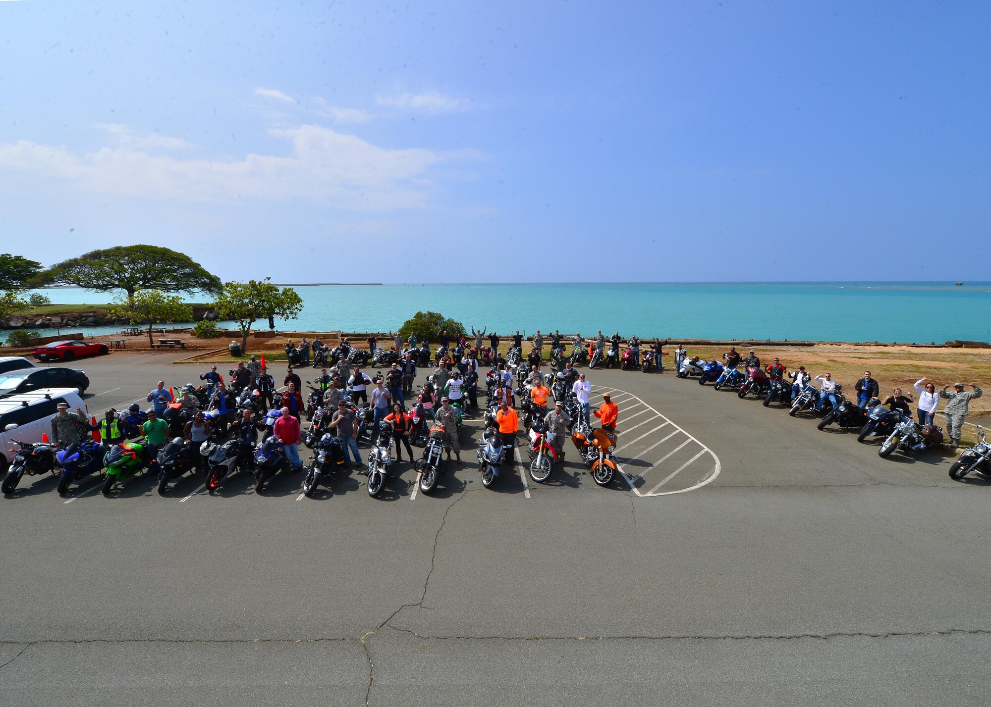 Military members from Headquarters Pacific Air Forces and 15th Wing ride across the installation after receiving a motorcycle safety briefing during Motorcycle Safety Day on Joint Base Pearl Harbor-Hickam, April 1, 2016. Approximately 175 motorcycle riders from JBPHH met up at the Hickam Memorial  Theater to talk about motorcycle safety as well as share personal stories and experiences pertaining to riding. The motorcycle safety event fulfilled an Air Force annual requirement for motorcycle riders. (U.S. Air Force photo by Tech. Sgt. Aaron Oelrich/released) 