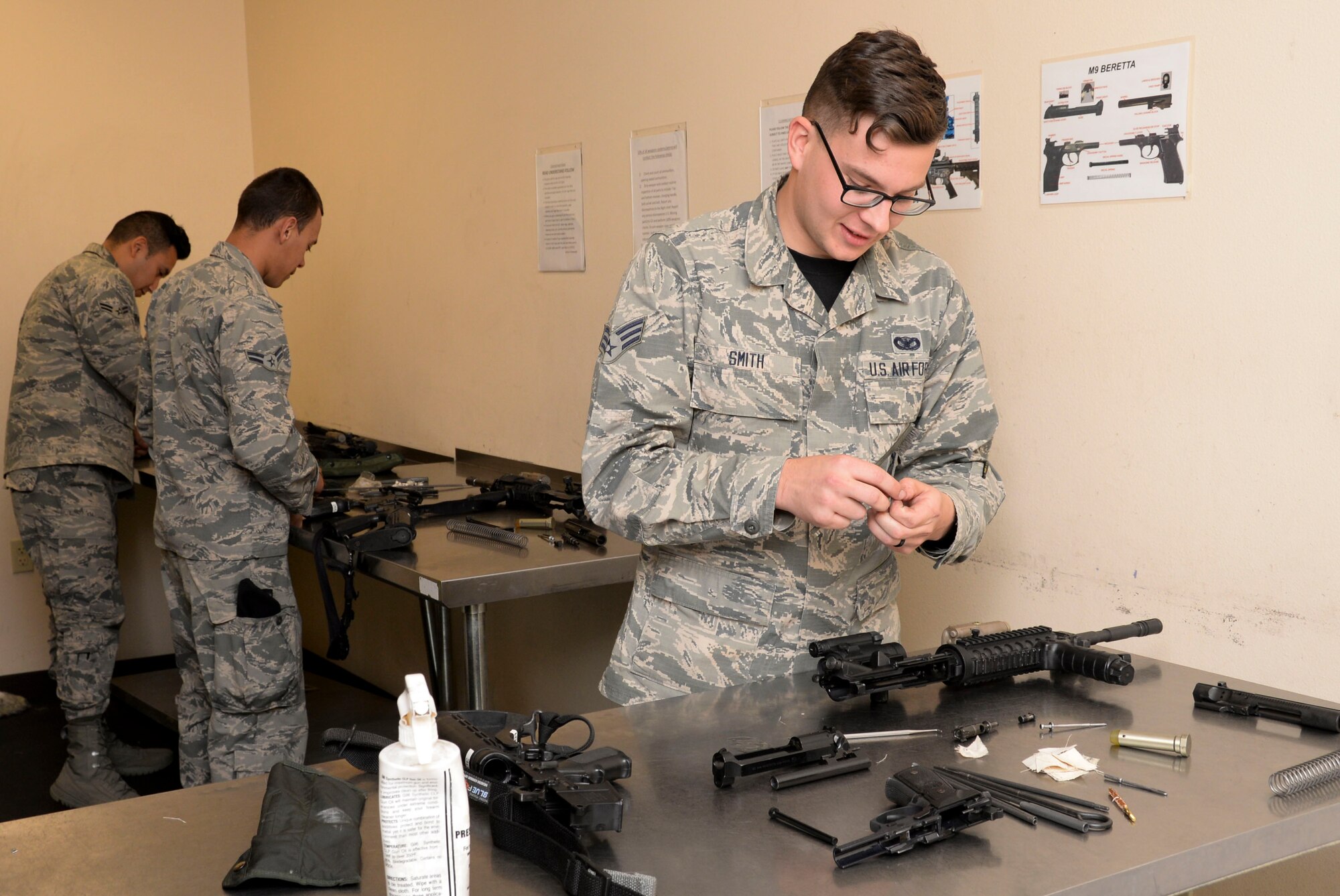 Senior Airman Brandon Smith, 2nd Security Forces Squadron installation entry controller, cleans his M4 carbine at Barksdale Air Force Base, La., April 1. Airmen assigned to the 2nd SFS must clean their weapons once a month to keep them in proper working condition. (U.S. Air Force photo/Senior Airman Amanda Morris)