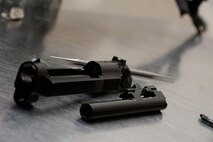 Parts of a Beretta M-9 sit on cleaning table before undergoing routine maintenance at Barksdale Air Force Base, La., April 1. Airmen assigned to 2nd Security Forces Squadron clean their M4 carbine and Beretta M9 monthly to keep them in proper working condition. (U.S. Air Force photo/Senior Airman Amanda Morris)