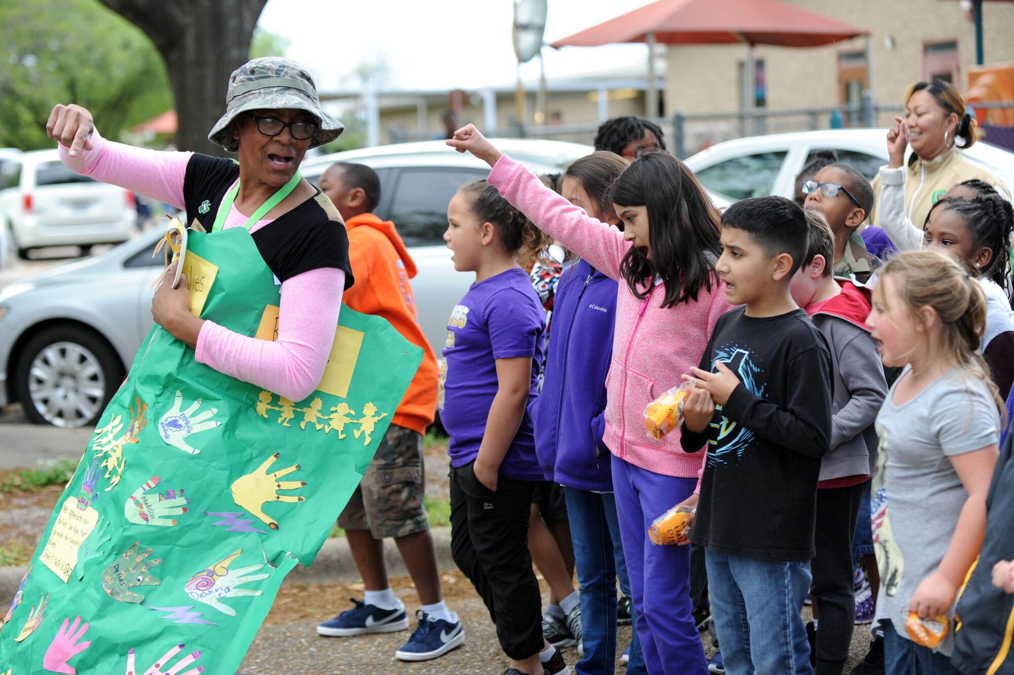 Children of all ages dance and cheer during the Month of the Military Child Parade at Barksdale Air Force Base, La., April 1. The Child Development Center will be hosting several events throughout April including a Military Child Carnival. (U.S. Air Force photo/Airman Alexis C. Frost)