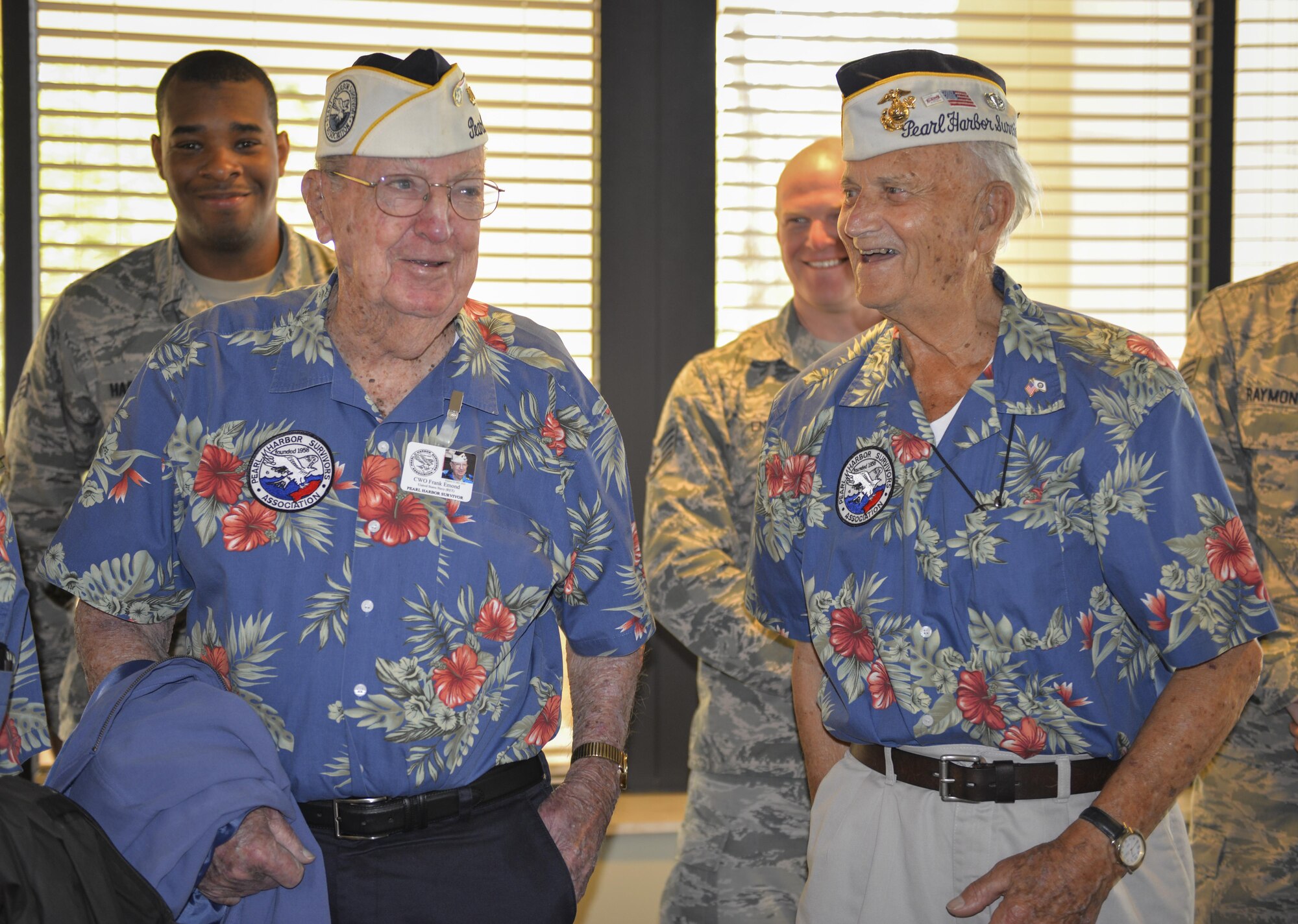 Retired U.S. Navy Chief Warrant Officer 4 Francis Edmond, left, and retired U.S. Marine Sgt. Maj. Bill Braddock, Pearl Harbor survivors, chat with Air Commandos during lunch at the Riptide Dining Facility at Hurlburt Field, Fla., April 5, 2016. During a base tour, Edmond, Braddock and two fellow Pearl Harbor survivors spent time with Air Commandos to discuss their experiences and the differences they see in today’s force. (U.S. Air Force photo by 2nd Lt. Jaclyn Pienkowski)