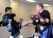 Senior Airman Adrian Cook, 56th Security Forces Squadron patrolman, spars with an instructor during his black belt ceremony at Sentosa Martial Arts in Avondale, Ariz., March 12, 2016. In order to receive the black belt, Cook had to go through rigorous training which included boxing, sparring, and ground game (U.S. Air Force photo by Senior Airman Devante Williams)