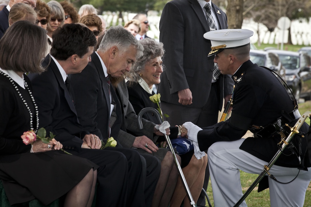 U.S. Marine Corps Col. Benjamin T. Watson, commanding officer for Marine Barracks Washington, D.C. gives condolences to Jane Anderson, wife of retired Gen. Earl E. Anderson, former assistant commandant of the Marine Corps, during a funeral for her husband at the Arlington National Cemetery, Arlington, Va., March 31, 2016. Anderson was the first active duty Marine Naval Aviator to be promoted to for-star rank, and he became the assistant commandant of the Marine Corps on April 1, 1972. (U.S. Marine Corps photo by Lance Cpl. Alex A. Quiles /Not Released)
