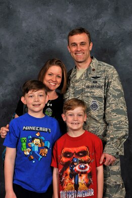 Maj. Scott Johnson, Leia, their children, Will (10) and Ben (7) pose together at Scott Air Force Base, Illinois, March 29, 2016. During Leia’s trip up Mount Kilamanjaro, she said “Everybody brought up the topic of their families.” (U.S. Air Force Photo by Senior Airman Megan Friedl)