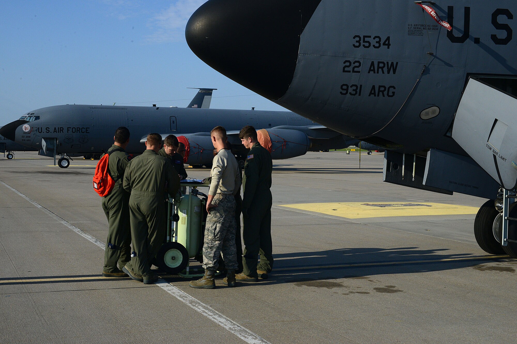 The aircrew of a KC-135 Stratotanker review a pre-flight checklist with maintenance personnel before a training exercise, Sept. 2, 2015, at McConnell Air Force Base, Kan. The KC-135’s primary mission is aerial refueling, which enhances the Air Force's capability to accomplish the primary mission of global reach. (U.S. Air Force photo/Airman Jenna K. Caldwell)