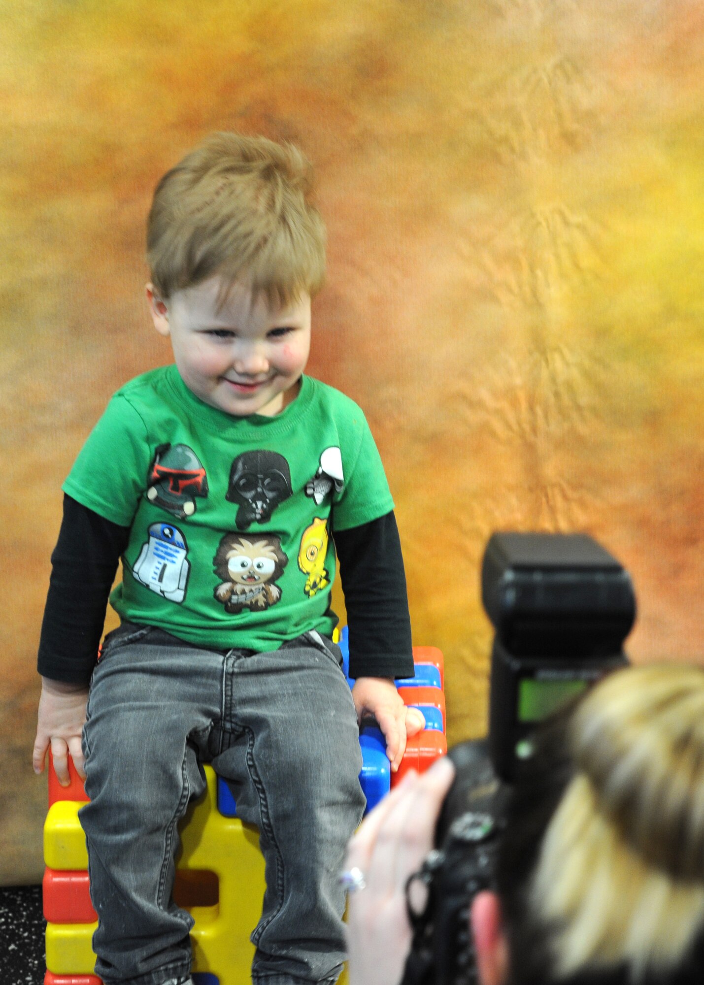 Luke Davis, 2, smiles for the camera during the Beautiful Child Photo Shoot and Activity Fair April 5, 2016, on Grand Forks Air Force Base, N.D. Warriors of the North were allowed to bring their children in for a photo during the event that kicked off the Month of the Military Child. (U.S. Air Force photo by Airman 1st Class Ryan Spark/Released)