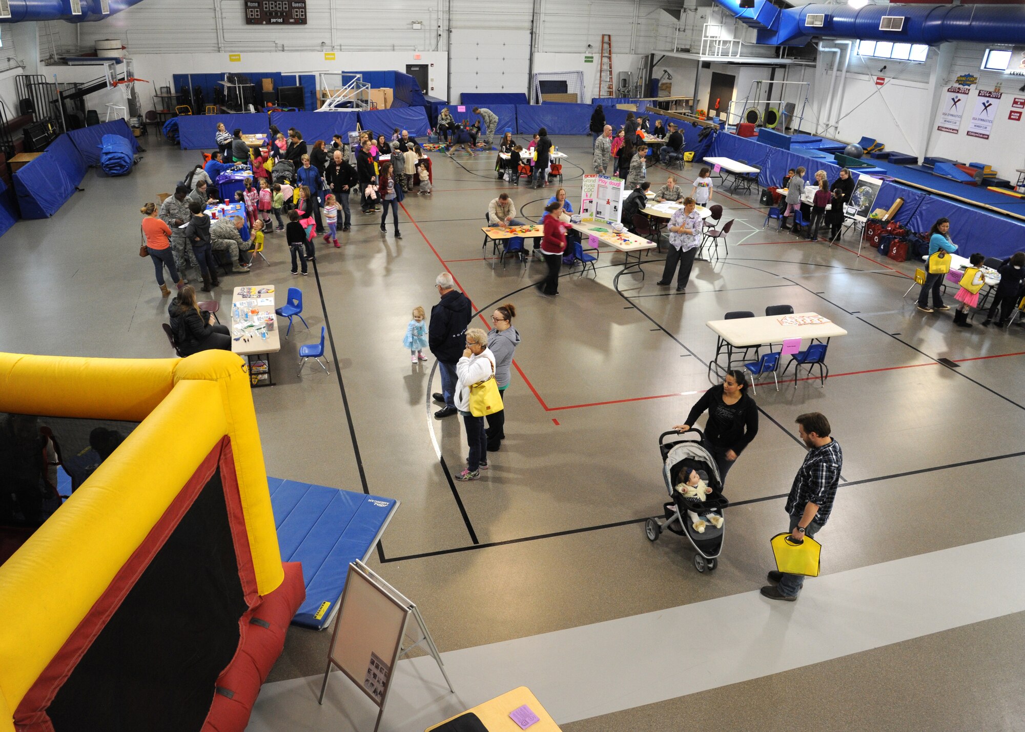 Airmen and their families participate in the Beautiful Child Photo Shoot and Activity Fair April 5, 2016, on Grand Forks Air Force Base, N.D. The event kicked off the Month of the Military Child at Grand Forks AFB. (U.S. Air Force photo by Airman 1st Class Ryan Spark/Released)