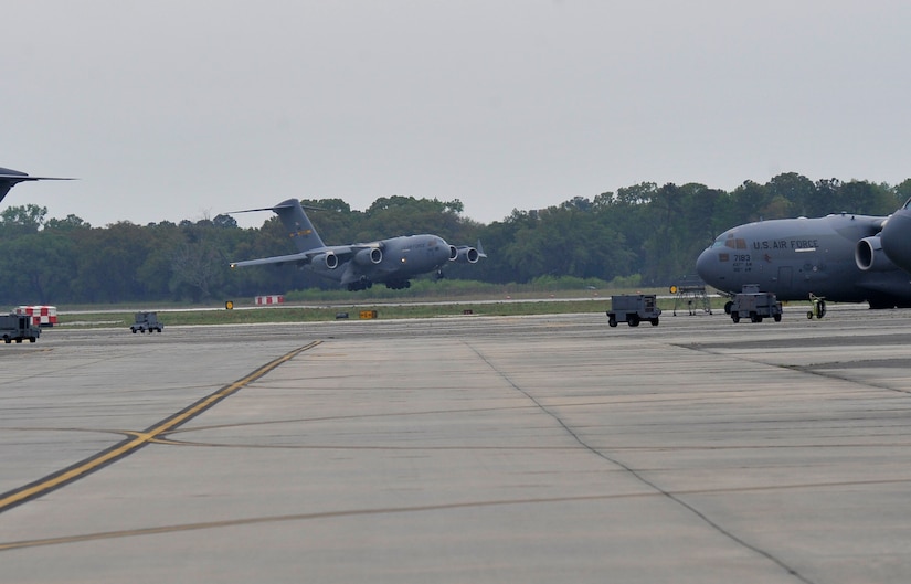 A C-17 Globemaster III returns to Joint Base Charleston, April 1, 2016,  after delivering family members to Baltimore, Maryland, during an ordered departure from Turkey. Members from 14th and 15th Airlift Squadrons the 437th Aircraft Maintenance Squadron comprised one of the first aircrews involved in the mission. (U.S. Air Force photo/Airman Megan Munoz) 